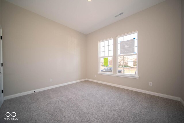 7936 Beaumont Green Pl, Indianapolis, IN 46250 - spare room featuring carpet floors and baseboards