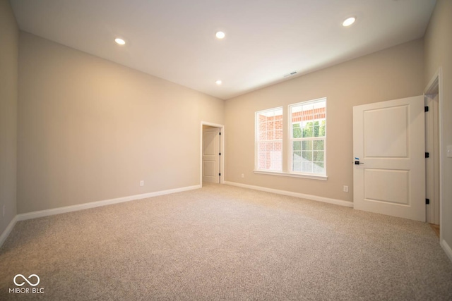 unfurnished room featuring carpet