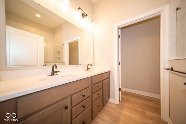 bathroom with vanity and hardwood / wood-style flooring