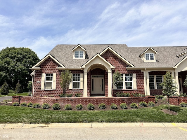 7936 Beaumont Green Pl, Indianapolis, IN 46250 - view of front facade featuring brick siding, a shingled roof, and a front yard