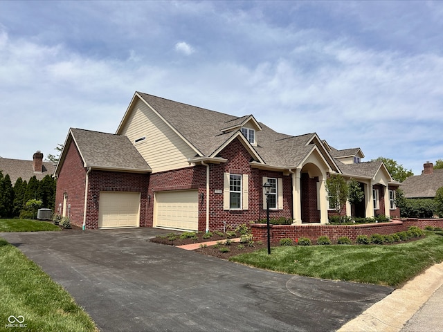 7936 Beaumont Green Pl, Indianapolis, IN 46250 - view of front of property with brick siding, asphalt driveway, a garage, and a shingled roof