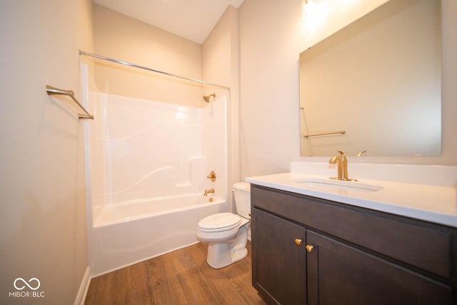 full bathroom with toilet, vanity, shower / bath combination, and hardwood / wood-style flooring