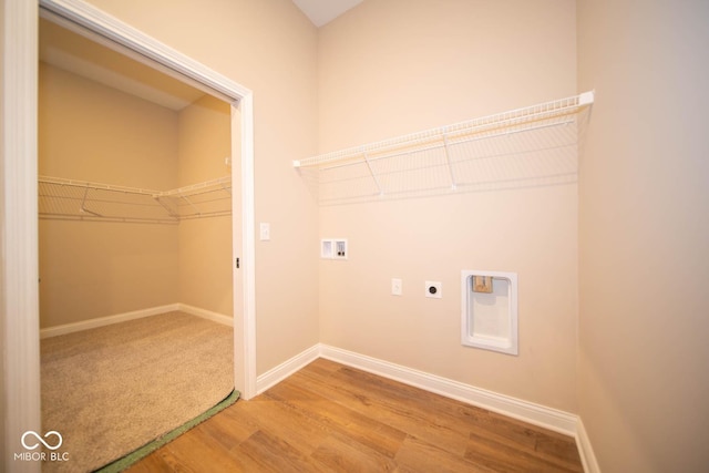 washroom featuring washer hookup, electric dryer hookup, and hardwood / wood-style floors