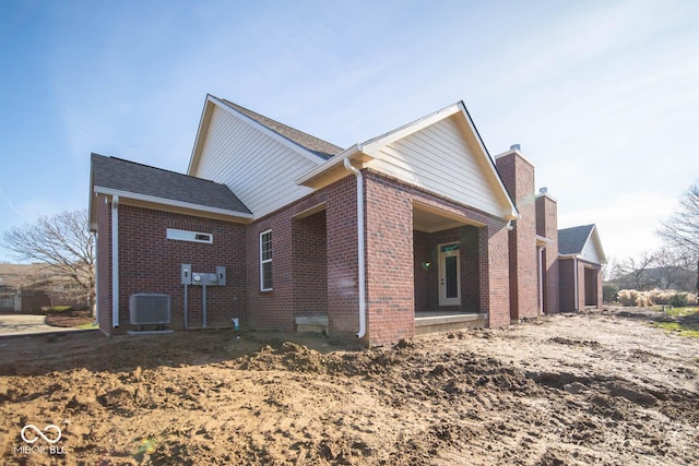 view of property exterior featuring central AC and a garage