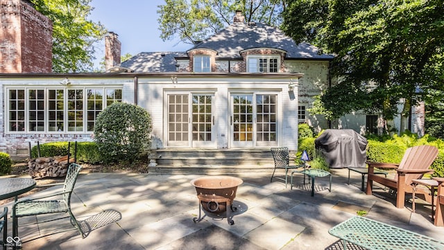 rear view of property with a patio area