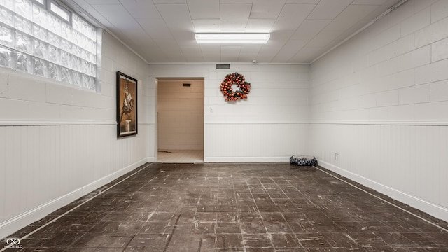 unfurnished room with ornamental molding