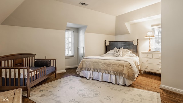 bedroom with wood-type flooring