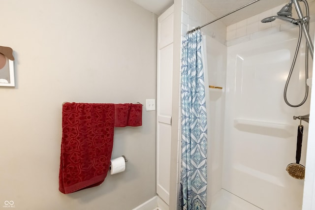 bathroom with a shower with shower curtain