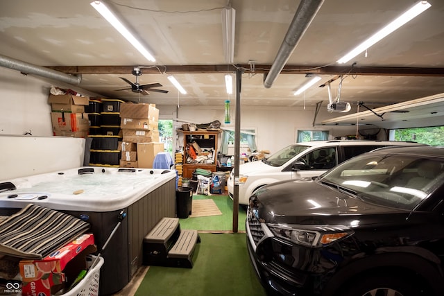 garage featuring ceiling fan and a garage door opener