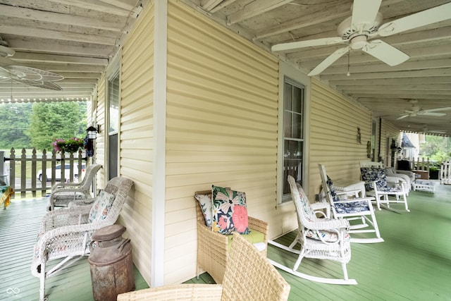 deck featuring ceiling fan and a porch