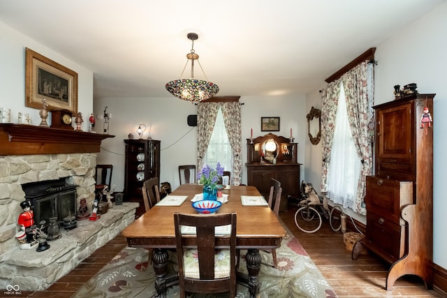 dining space with hardwood / wood-style floors