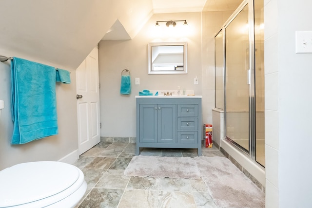 bathroom with vanity, toilet, an enclosed shower, and vaulted ceiling