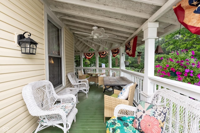 deck with a porch and ceiling fan