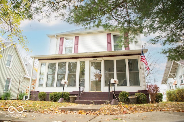 view of front facade featuring a sunroom