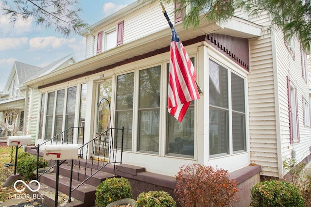 1104 W Main St, Crawfordsville, IN 47933 - view of side of property featuring a sunroom