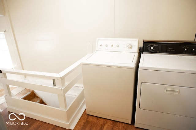 washroom featuring hardwood / wood-style flooring and independent washer and dryer