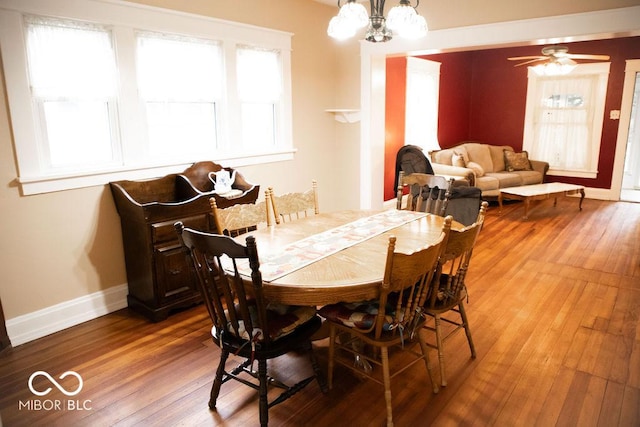 1104 W Main St, Crawfordsville, IN 47933 - dining space with healthy amount of natural light, hardwood / wood-style flooring, and a chandelier