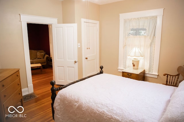 bedroom featuring hardwood / wood-style flooring