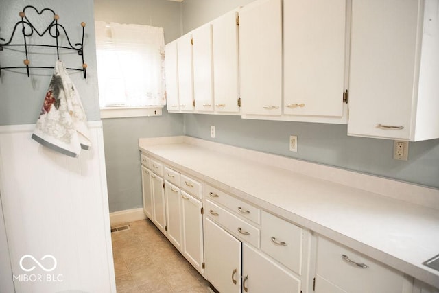 1104 W Main St, Crawfordsville, IN 47933 - kitchen featuring light countertops and white cabinets