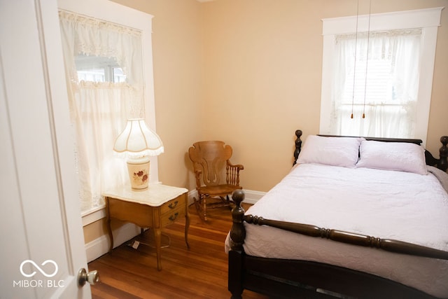 bedroom with hardwood / wood-style flooring