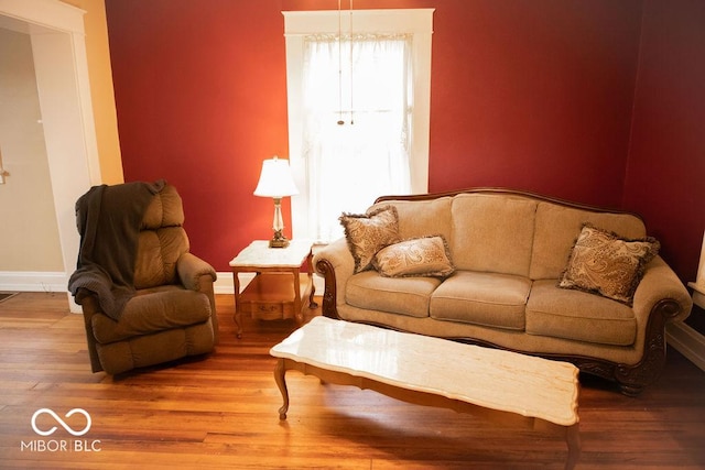 1104 W Main St, Crawfordsville, IN 47933 - living room featuring baseboards and wood finished floors