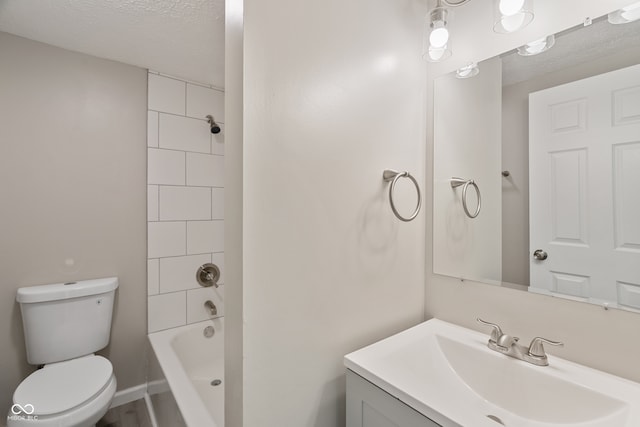 full bathroom featuring a textured ceiling, vanity, toilet, and shower / bathtub combination