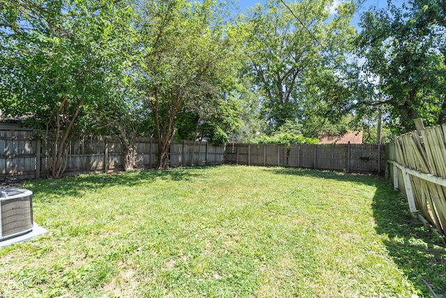 view of yard featuring central air condition unit