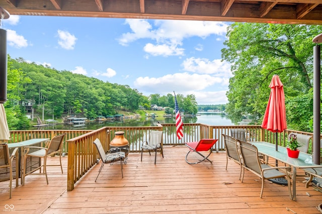 wooden deck with a water view