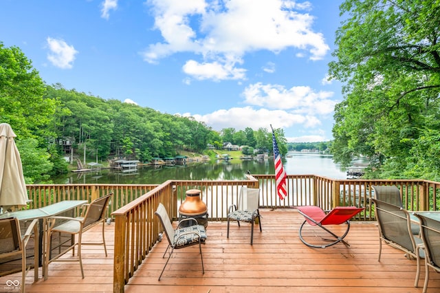 wooden deck with a water view