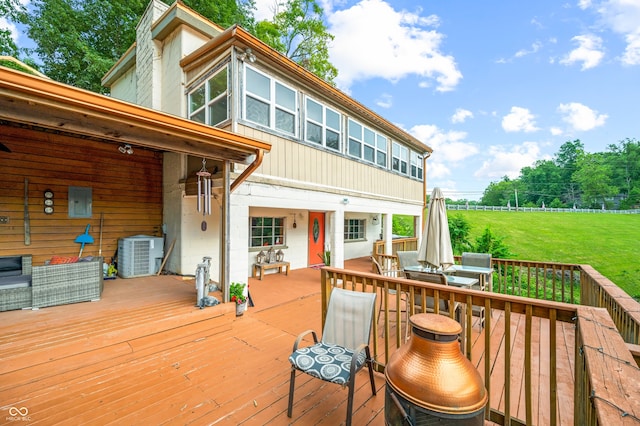 deck featuring a yard and central AC unit