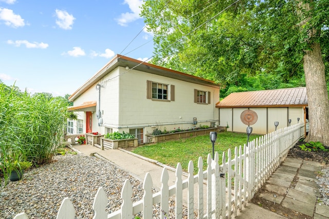 view of property exterior with an outdoor structure