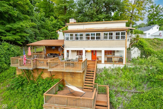 rear view of house with a deck