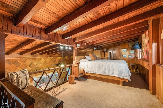 carpeted bedroom with wooden ceiling, lofted ceiling with beams, and wood walls