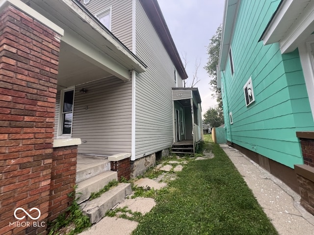 view of property exterior featuring a lawn