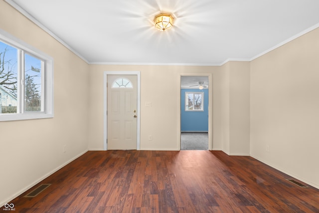 entrance foyer with ornamental molding and wood-type flooring