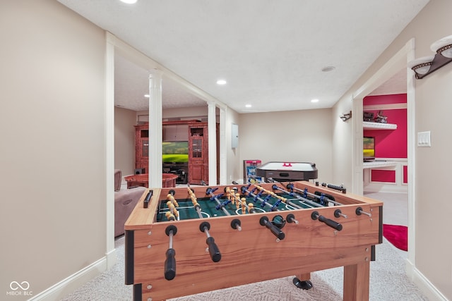 rec room featuring carpet flooring and ornate columns