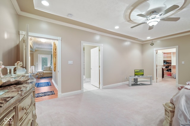 interior space featuring a textured ceiling, ceiling fan, and crown molding