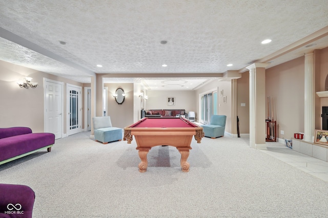 playroom featuring carpet floors, decorative columns, a textured ceiling, and billiards