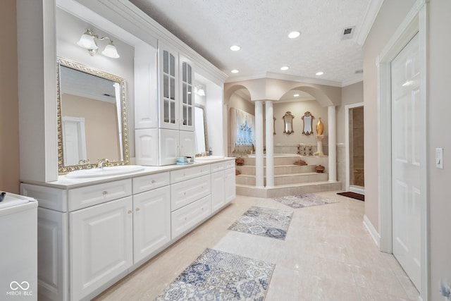 8292 S State Road 39th Rd S, Clayton, IN 46118 - full bath with ornamental molding, double vanity, recessed lighting, a textured ceiling, and decorative columns