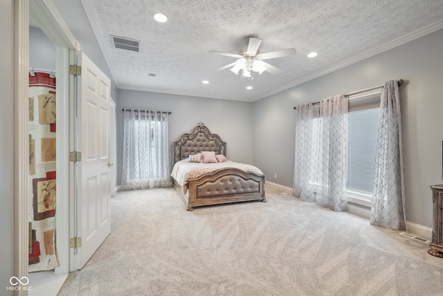 bedroom featuring ornamental molding, multiple windows, and a textured ceiling