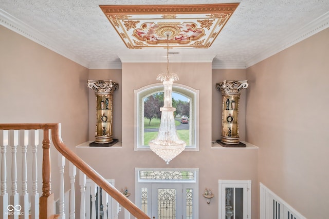 details with ornamental molding, a textured ceiling, and a chandelier