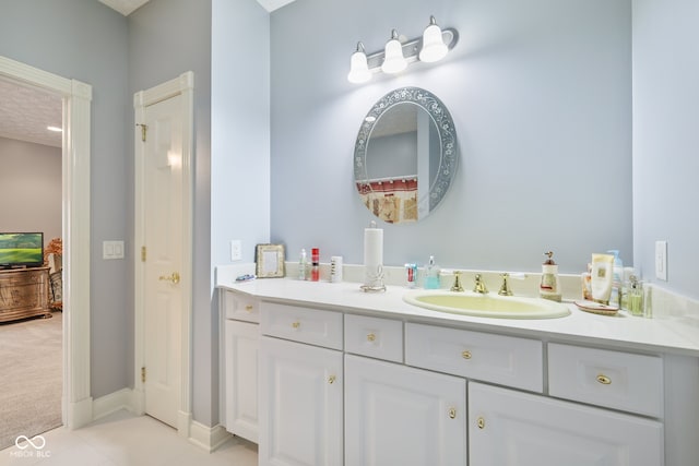 bathroom with vanity and tile patterned floors