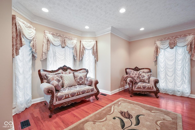 8292 S State Road 39th Rd S, Clayton, IN 46118 - living area with crown molding, a textured ceiling, baseboards, wood finished floors, and recessed lighting