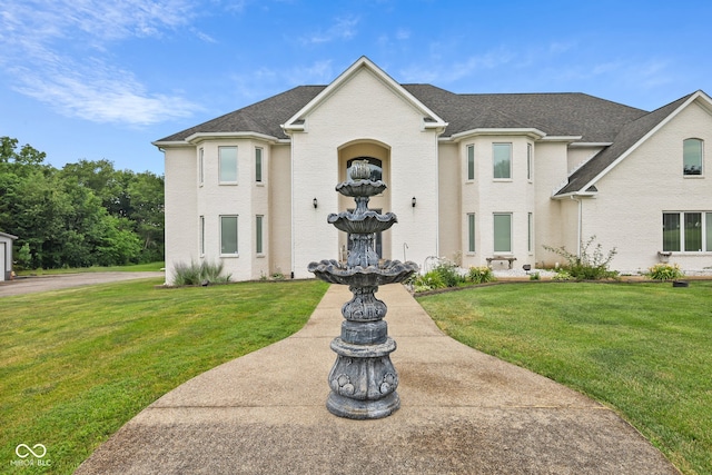 french country home with a front yard