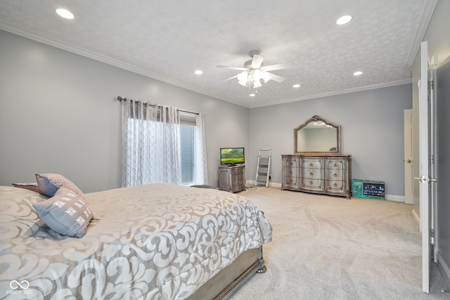 bedroom with carpet flooring, a textured ceiling, ceiling fan, and crown molding