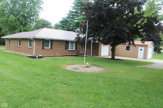 view of front of property featuring a garage and a front lawn