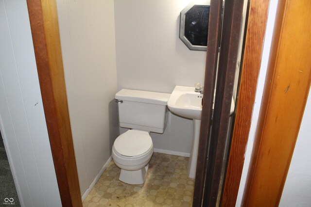 bathroom featuring tile patterned floors, sink, and toilet