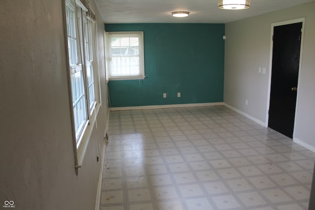 unfurnished room featuring tile patterned floors