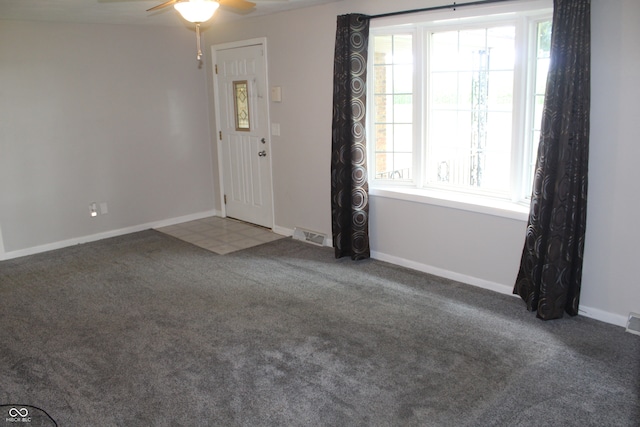 entryway featuring ceiling fan and carpet flooring