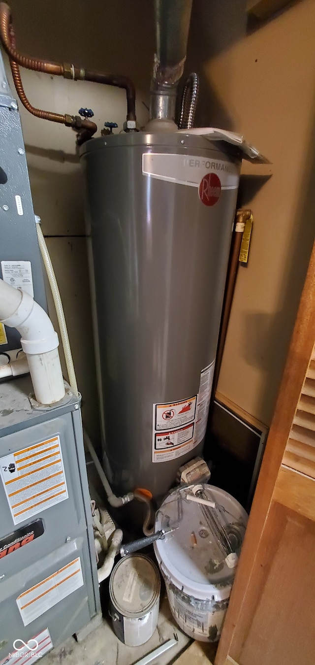 utility room with gas water heater